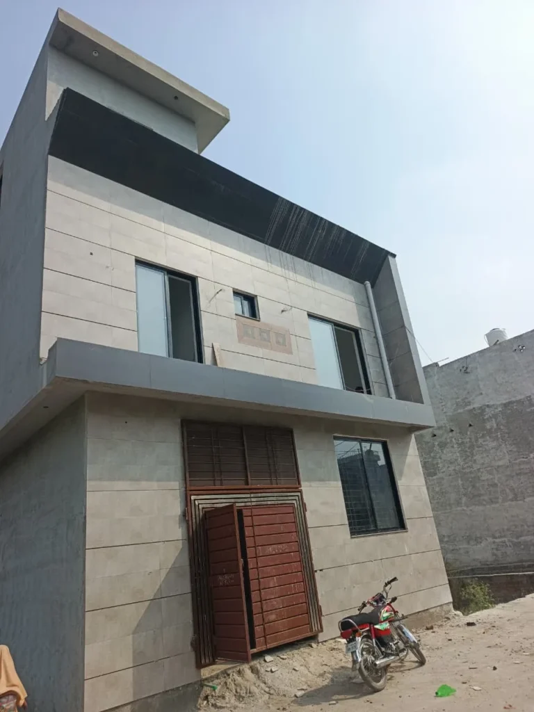 Black aluminum windows installed on a two-storey house at Hazari Colony Bedian Road