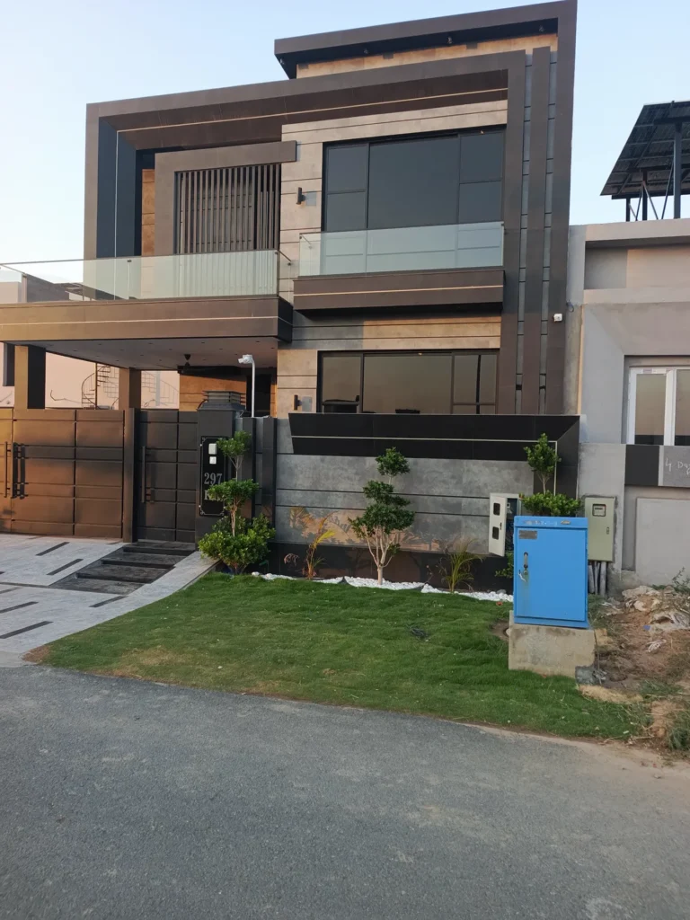 Black-framed floor-to-ceiling windows with frameless glass balcony railings