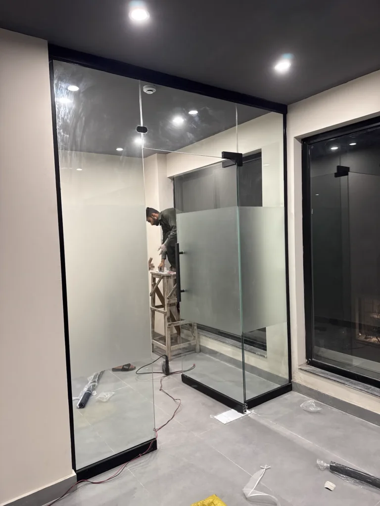 Office ceiling detail above glass partition installation