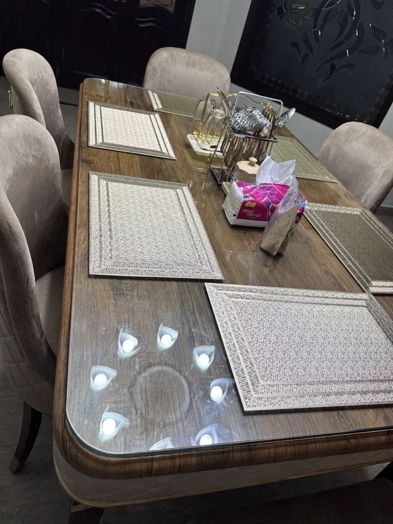 Dining table fitted with custom 12mm clear glass top