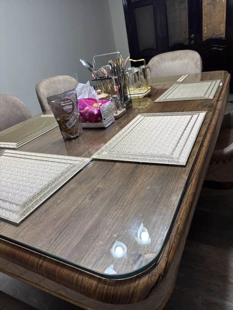 Close view of 12mm clear glass top on wooden dining table